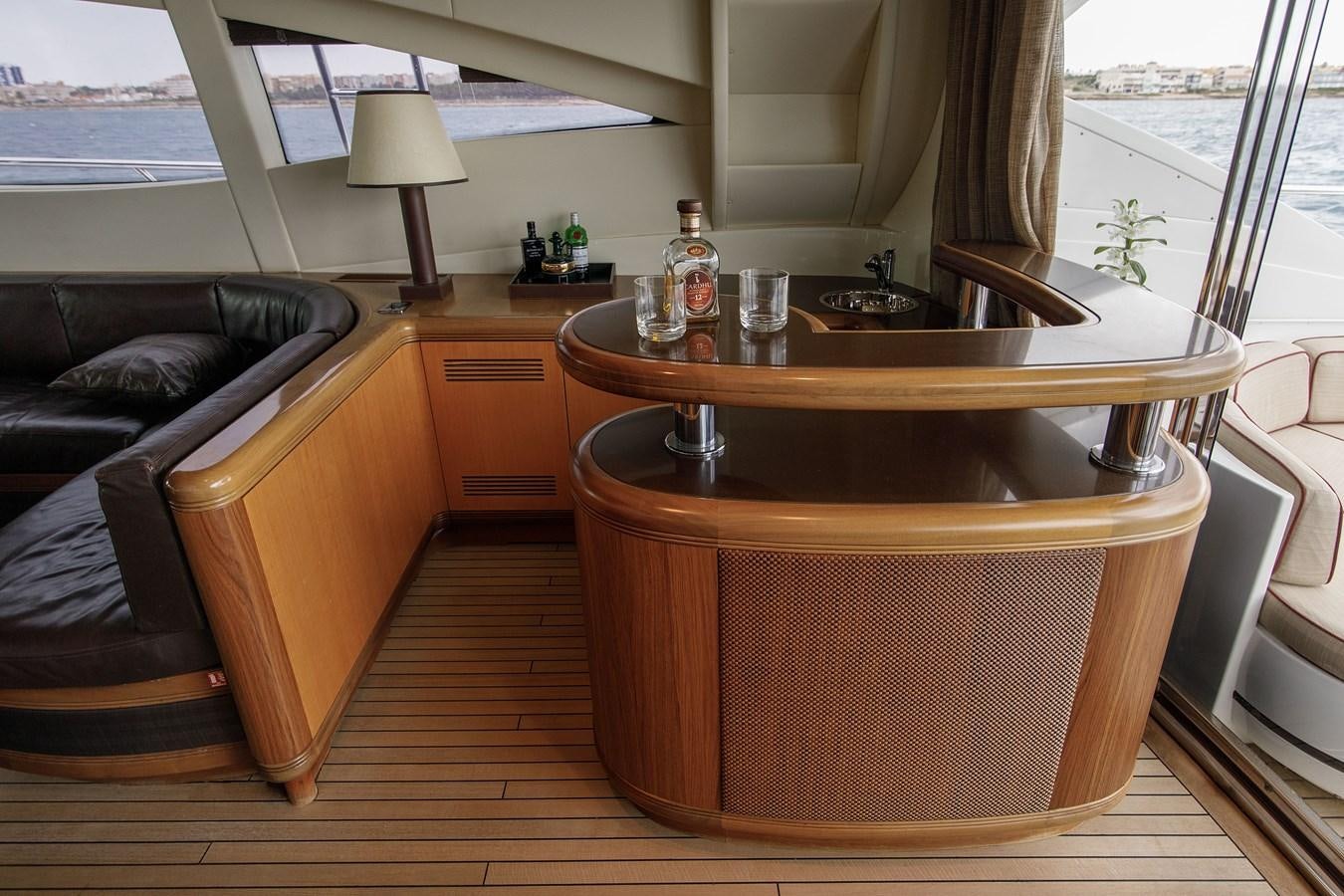 a wooden table in a living room aboard LITTLE ZOE Yacht for Sale
