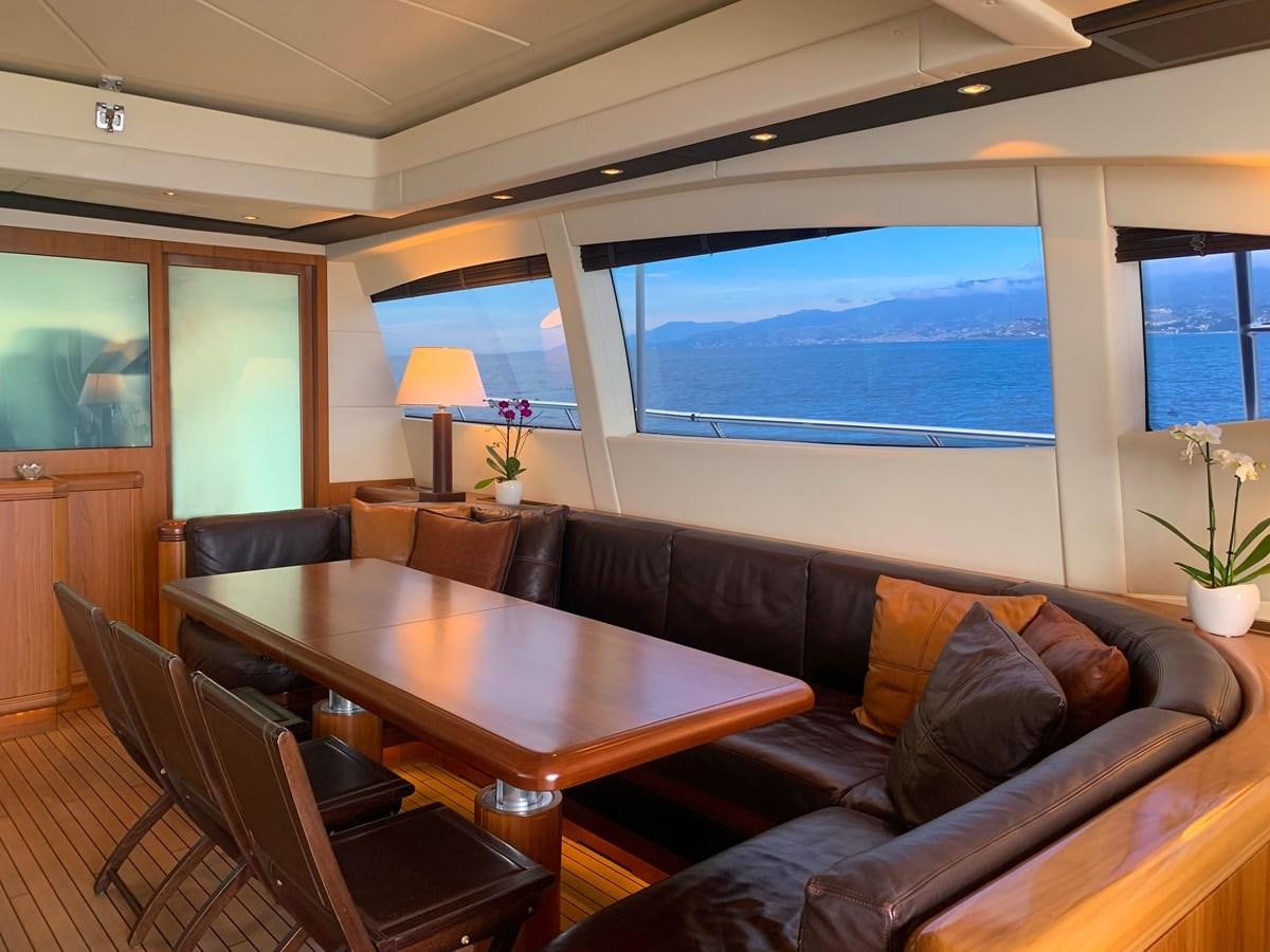 a living room with a leather couch aboard LITTLE ZOE Yacht for Sale