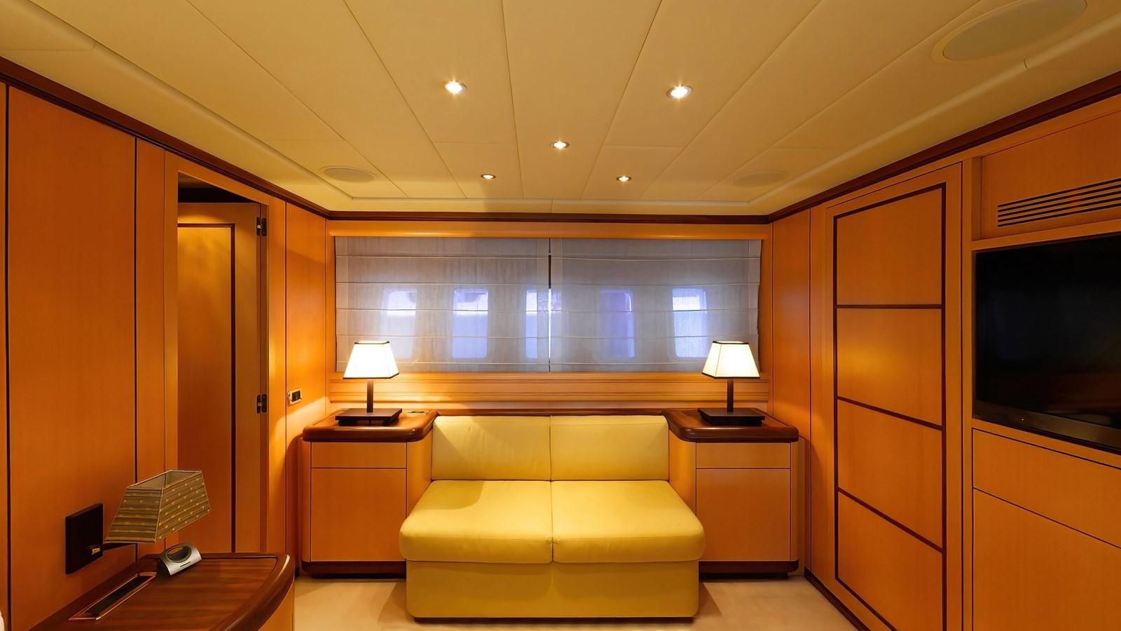 a living room with a couch and a tv aboard LITTLE ZOE Yacht for Sale