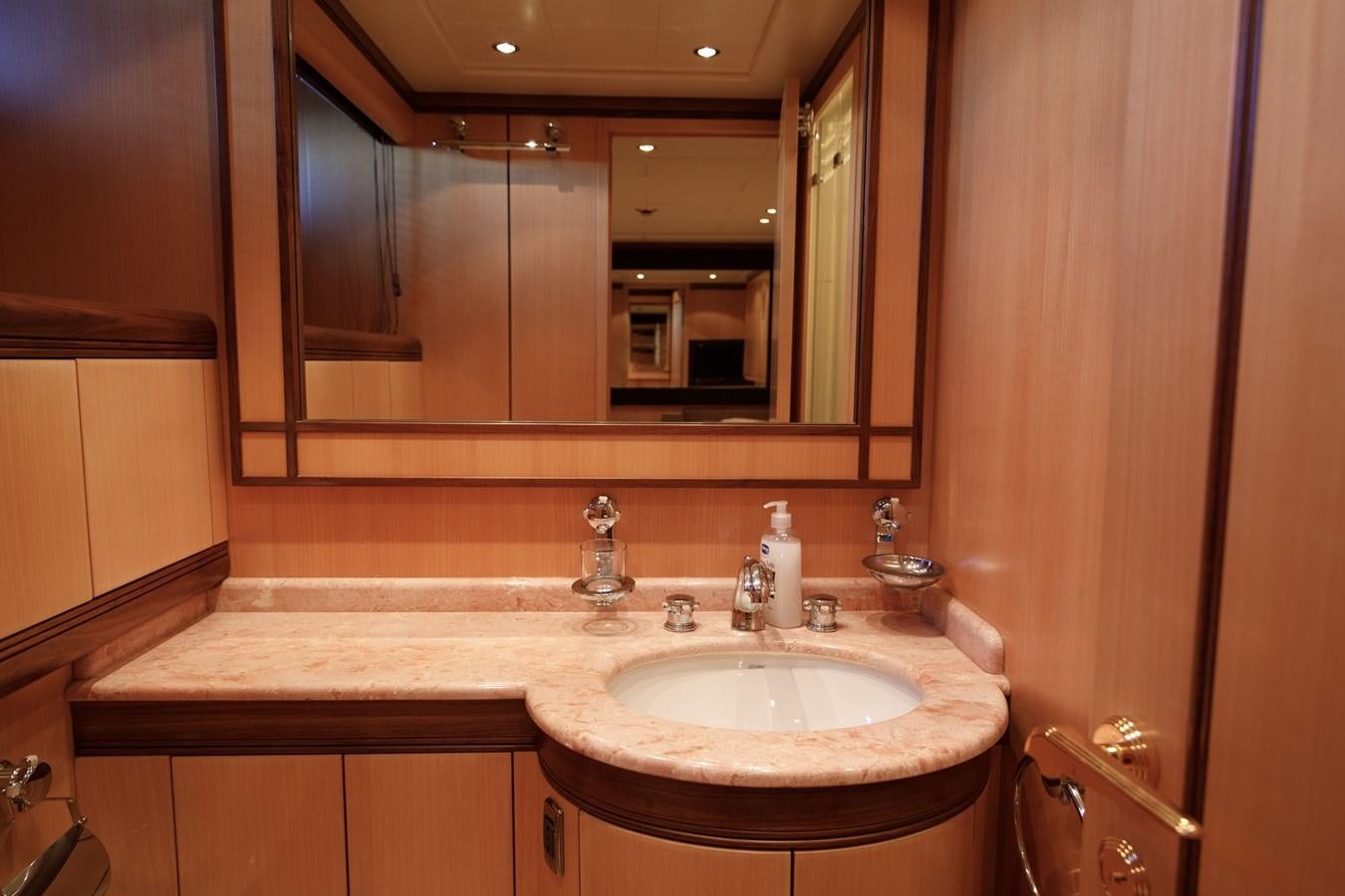 a bathroom with a large mirror aboard LITTLE ZOE Yacht for Sale