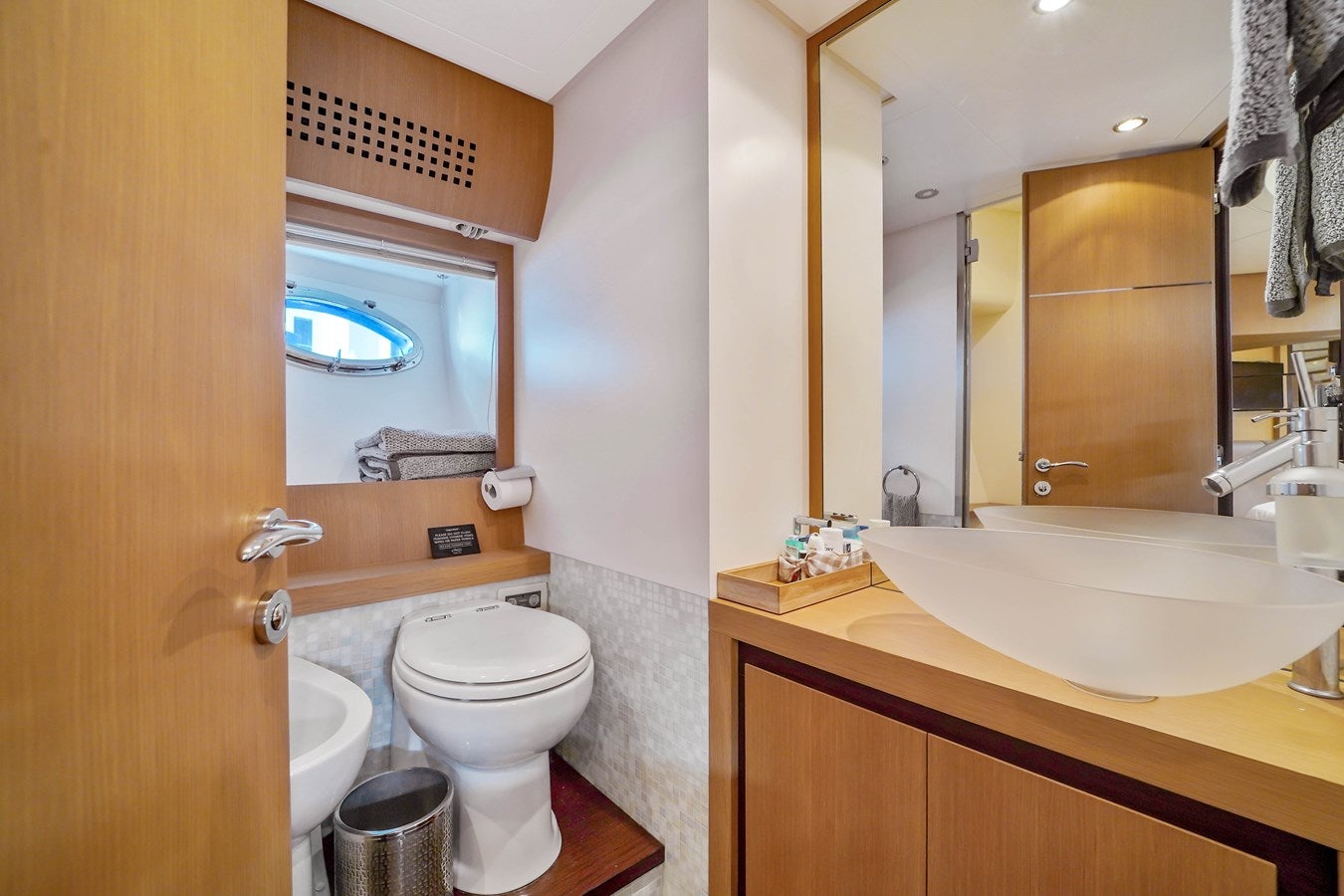 a bathroom with a sink and a toilet aboard SHADOW Yacht for Sale
