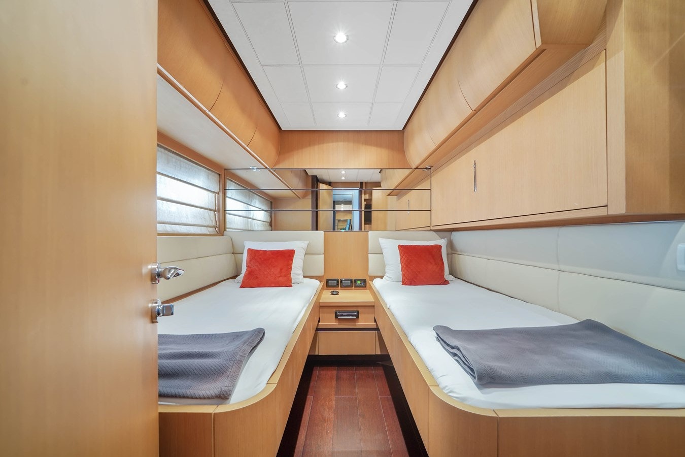 a room with beds and a sink aboard SHADOW Yacht for Sale