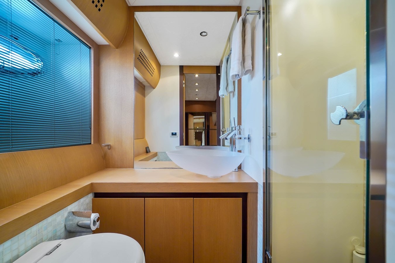 a bathroom with a sink and a mirror aboard SHADOW Yacht for Sale