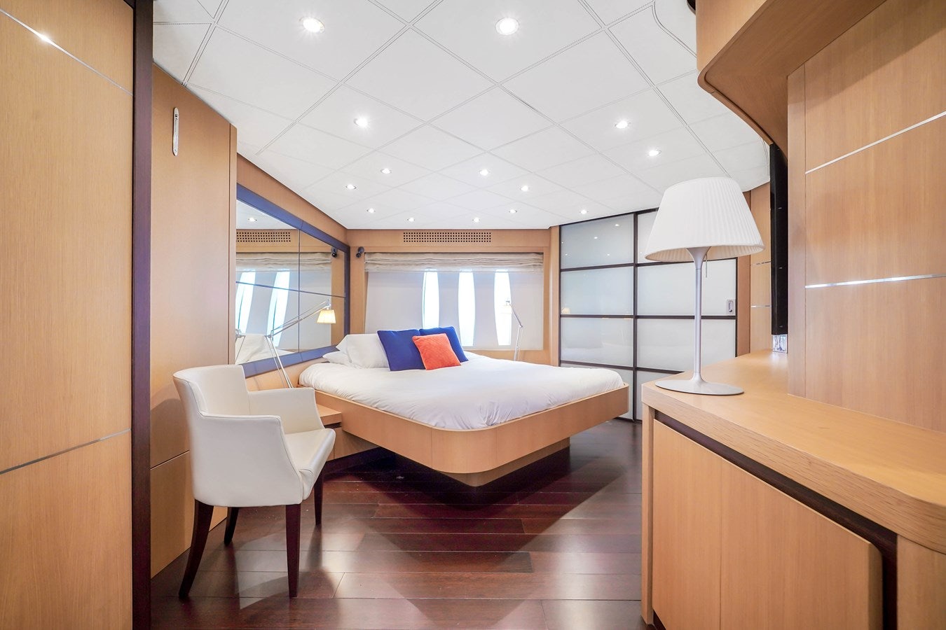 a bedroom with a bed and desk aboard SHADOW Yacht for Sale