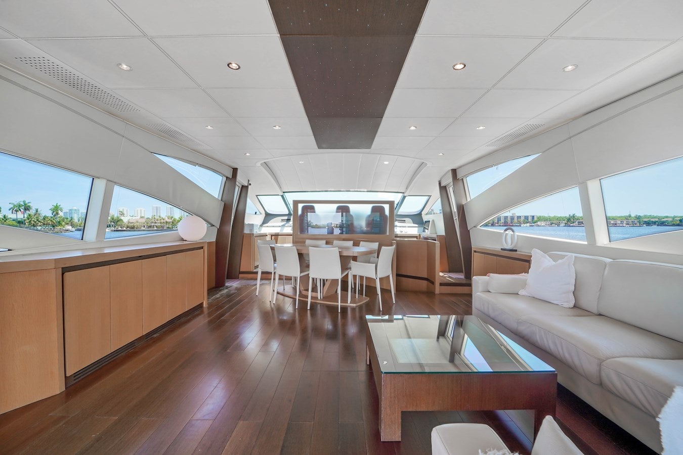 a living room with a wood floor aboard SHADOW Yacht for Sale