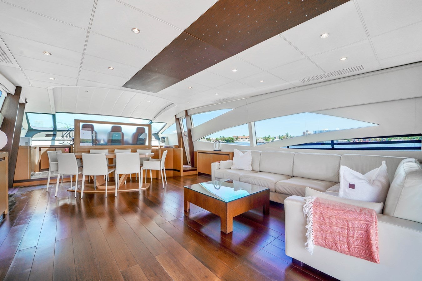 a living room with a large window aboard SHADOW Yacht for Sale
