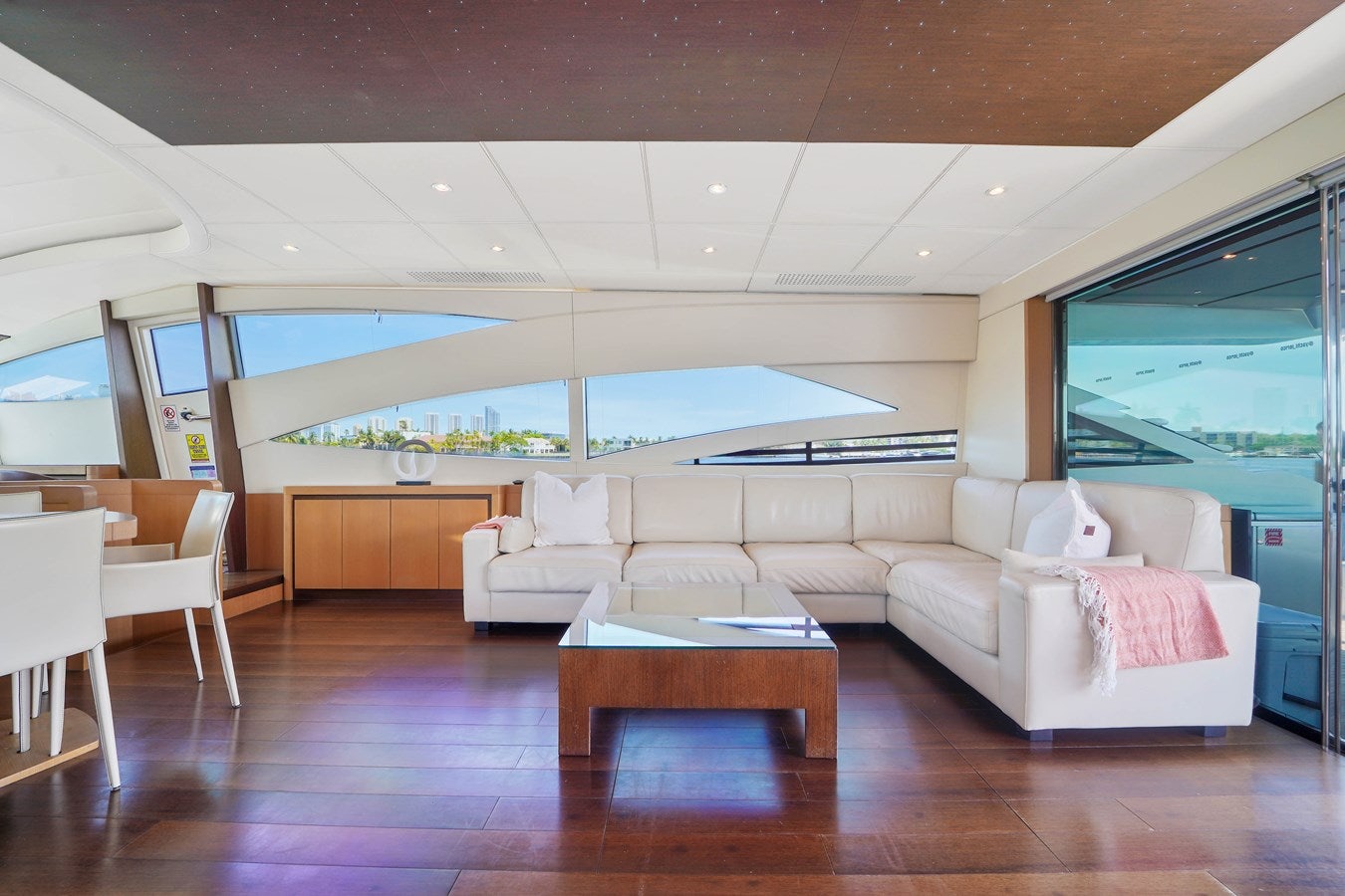 a living room with a large window aboard SHADOW Yacht for Sale