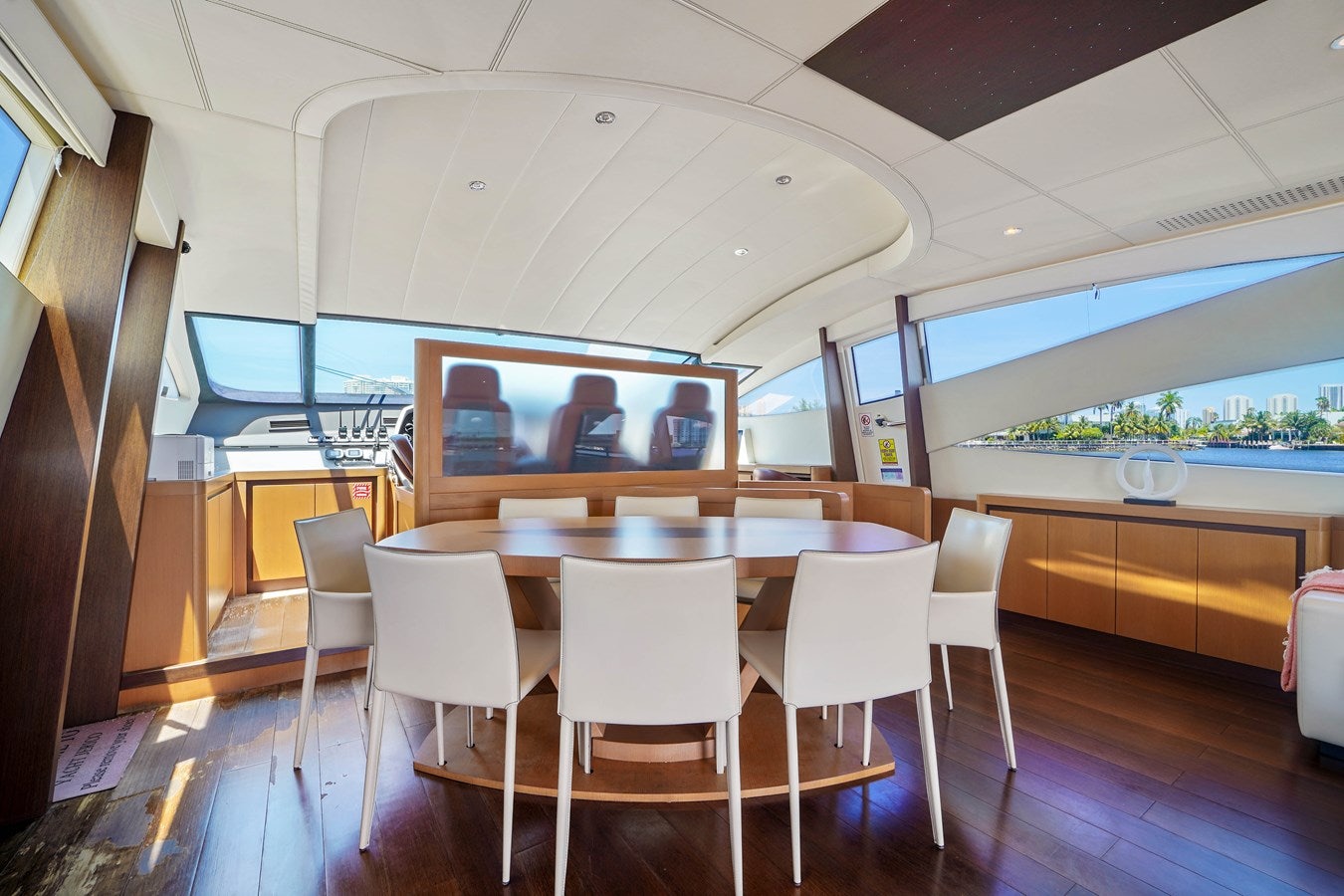 a room with tables and chairs aboard SHADOW Yacht for Sale