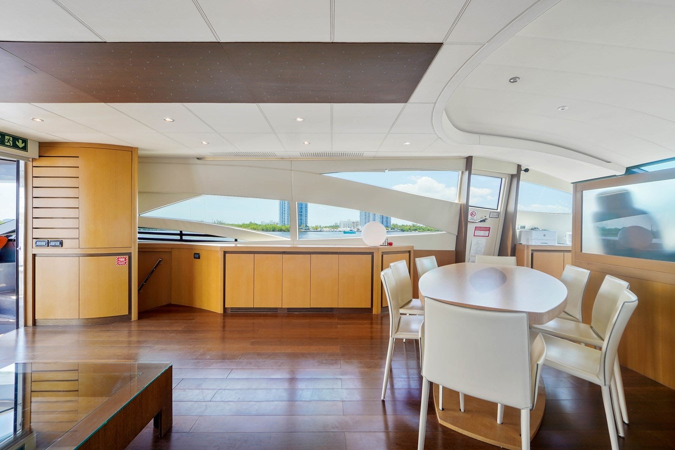a room with tables and chairs aboard SHADOW Yacht for Sale