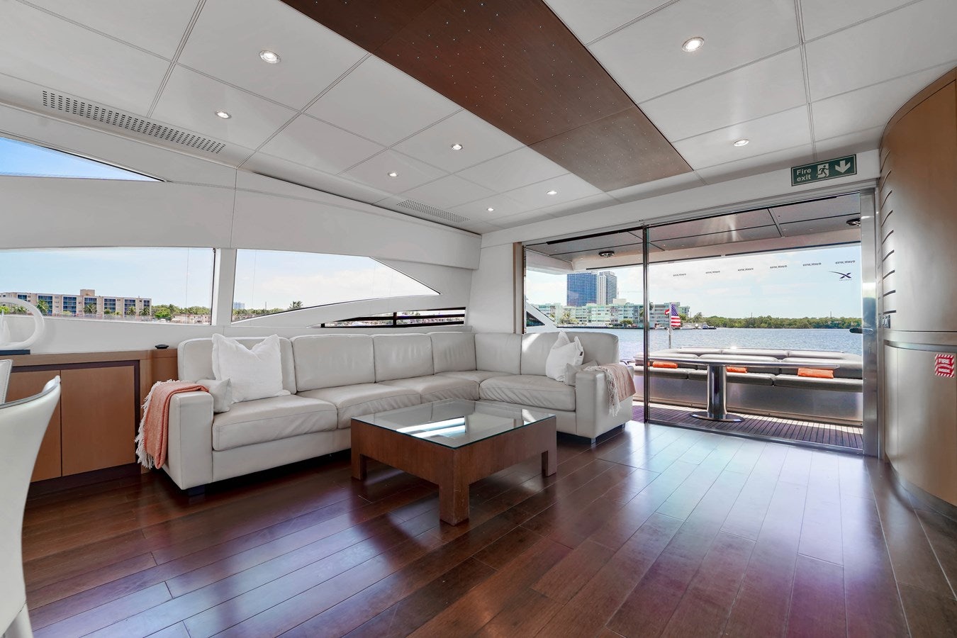 a living room with a wood floor aboard SHADOW Yacht for Sale