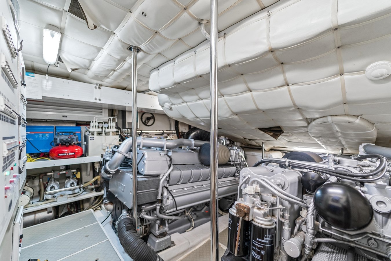 a room with a large group of pipes and machinery aboard SHADOW Yacht for Sale