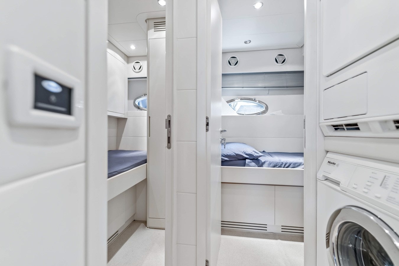 a room with white cabinets aboard SHADOW Yacht for Sale