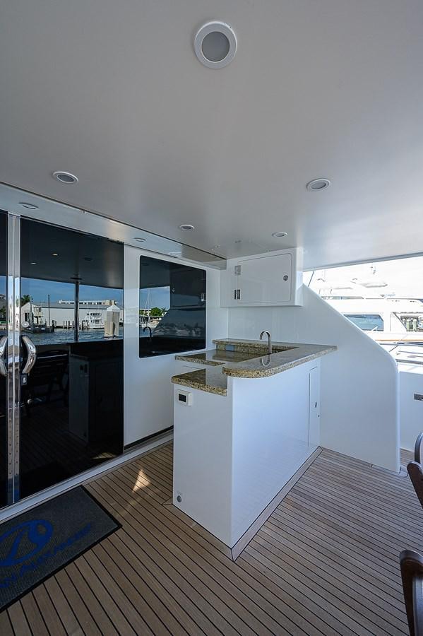 a kitchen with a wood floor aboard ONE SHOT Yacht for Sale