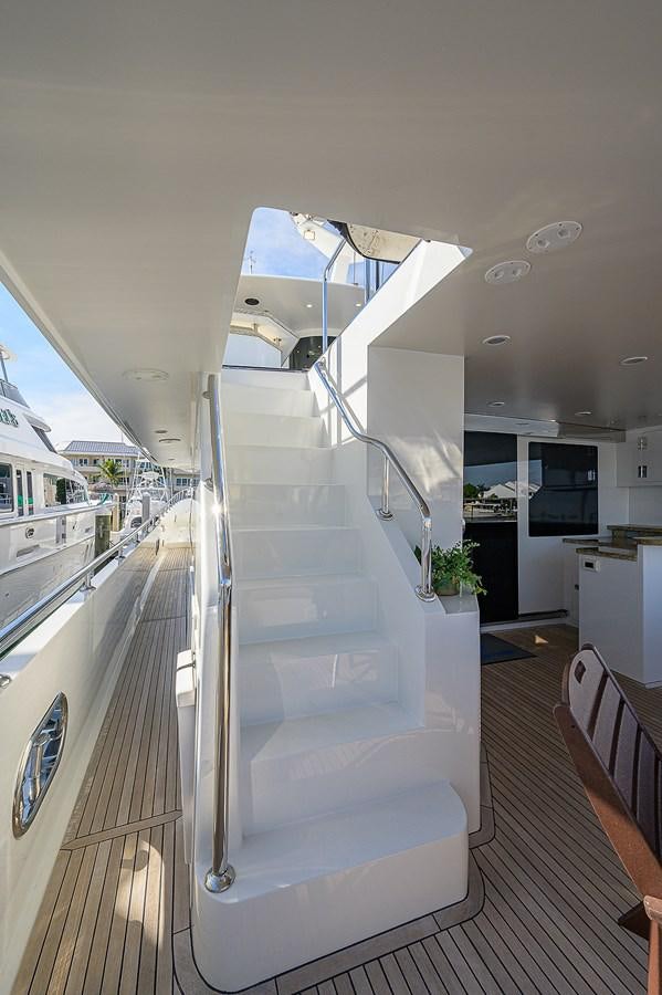 a long white staircase in a house aboard ONE SHOT Yacht for Sale