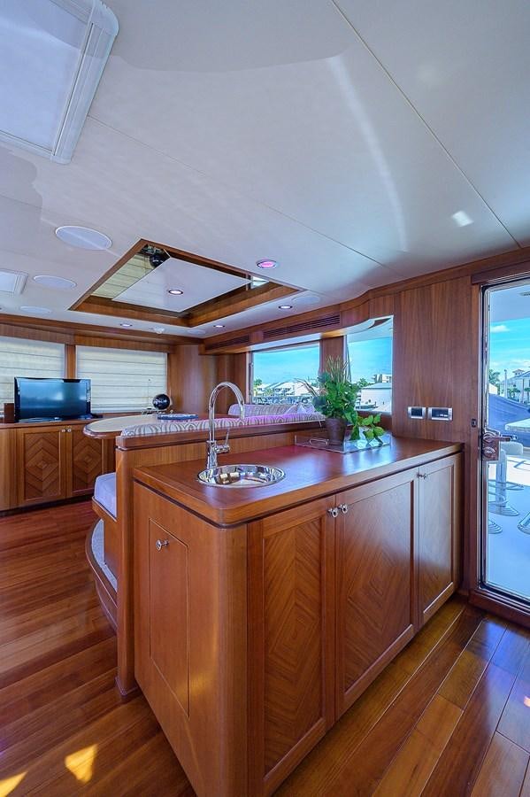 a kitchen with a large island aboard ONE SHOT Yacht for Sale