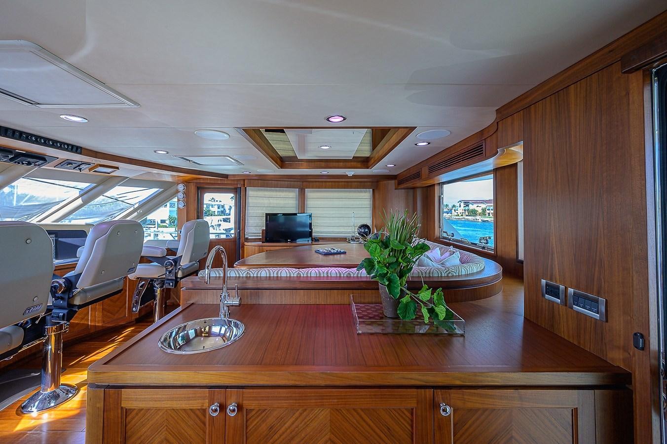 a room with a table and chairs aboard ONE SHOT Yacht for Sale