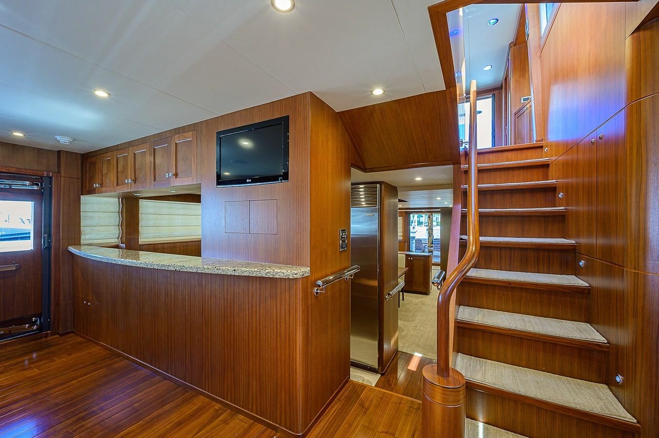 a wood staircase in a room aboard ONE SHOT Yacht for Sale