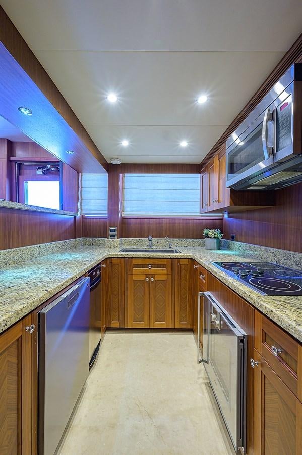 a kitchen with a large island aboard ONE SHOT Yacht for Sale