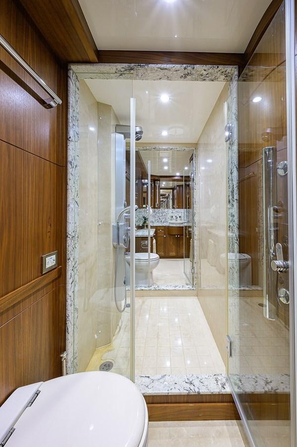 a bathroom with a glass shower aboard ONE SHOT Yacht for Sale