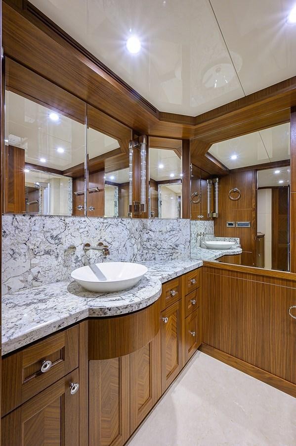 a bathroom with a large mirror aboard ONE SHOT Yacht for Sale