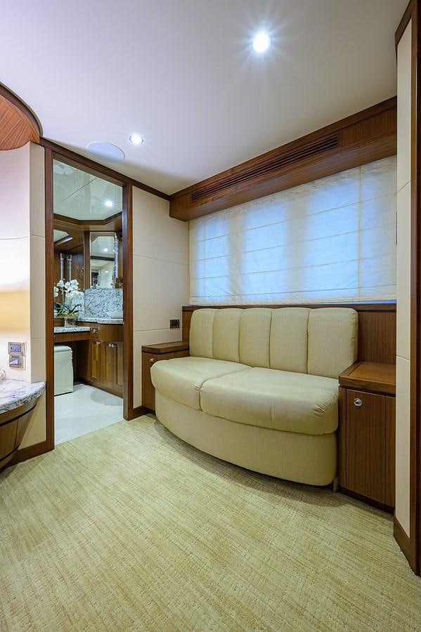 a living room with a mirror aboard ONE SHOT Yacht for Sale