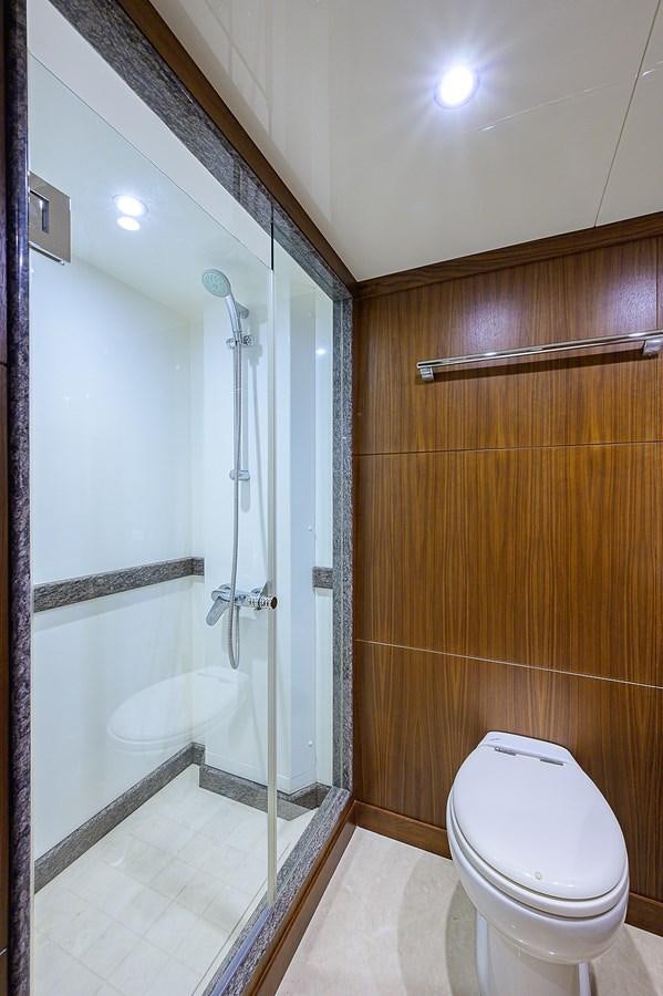 a bathroom with a shower and toilet aboard ONE SHOT Yacht for Sale