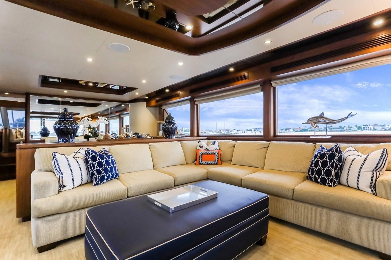 a living room with a couch and a table aboard ONE SHOT Yacht for Sale