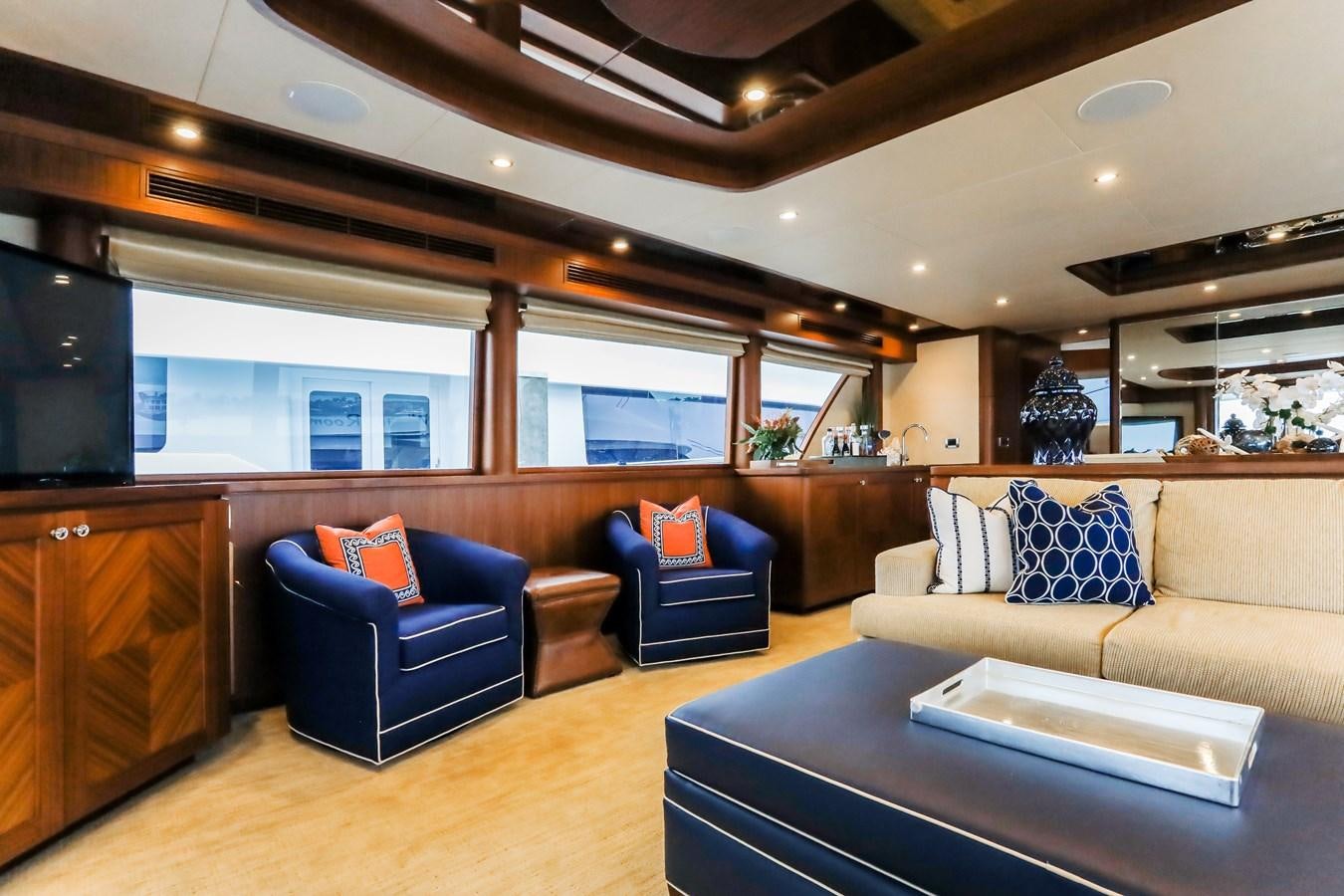 a living room with a couch and a tv aboard ONE SHOT Yacht for Sale