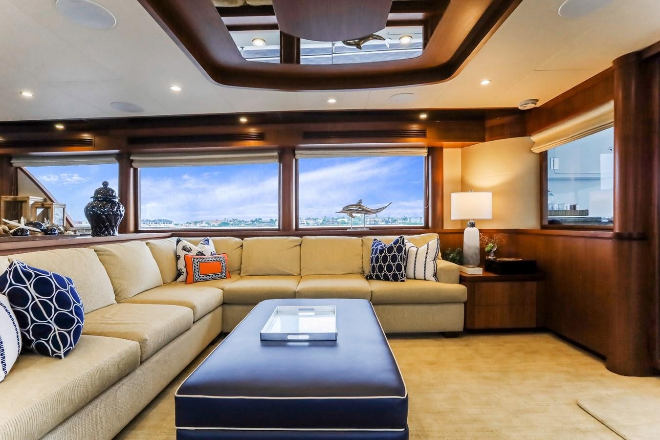 a living room with a couch and a table aboard ONE SHOT Yacht for Sale
