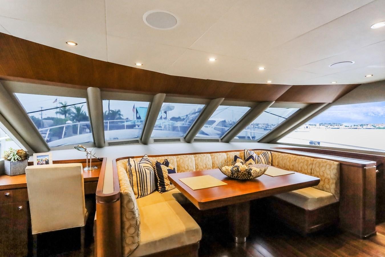 a room with a table and chairs aboard ONE SHOT Yacht for Sale