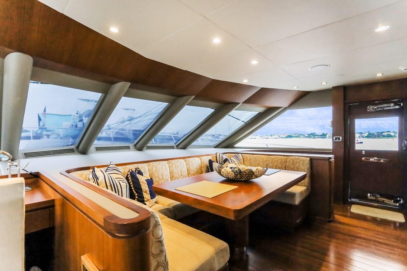 a room with a table and chairs aboard ONE SHOT Yacht for Sale