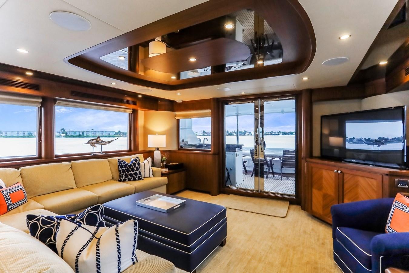 a living room with a large window aboard ONE SHOT Yacht for Sale