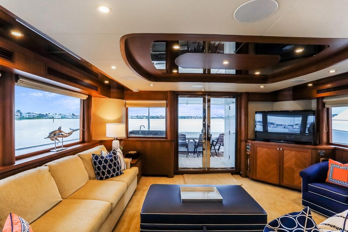a living room with a large window aboard ONE SHOT Yacht for Sale