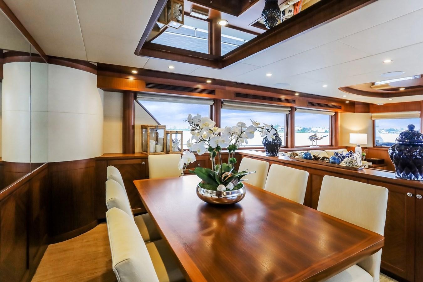 a room with a table and chairs aboard ONE SHOT Yacht for Sale