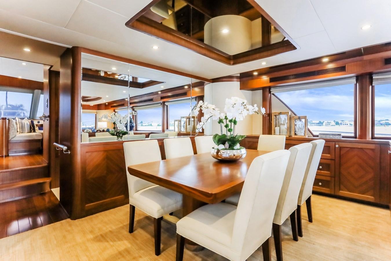a dining room with a table and chairs aboard ONE SHOT Yacht for Sale