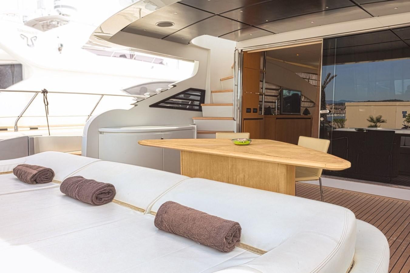 a room with a bed and a table aboard A&O Yacht for Sale