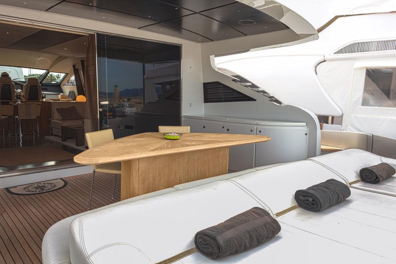a plane with a desk and chairs aboard A&O Yacht for Sale