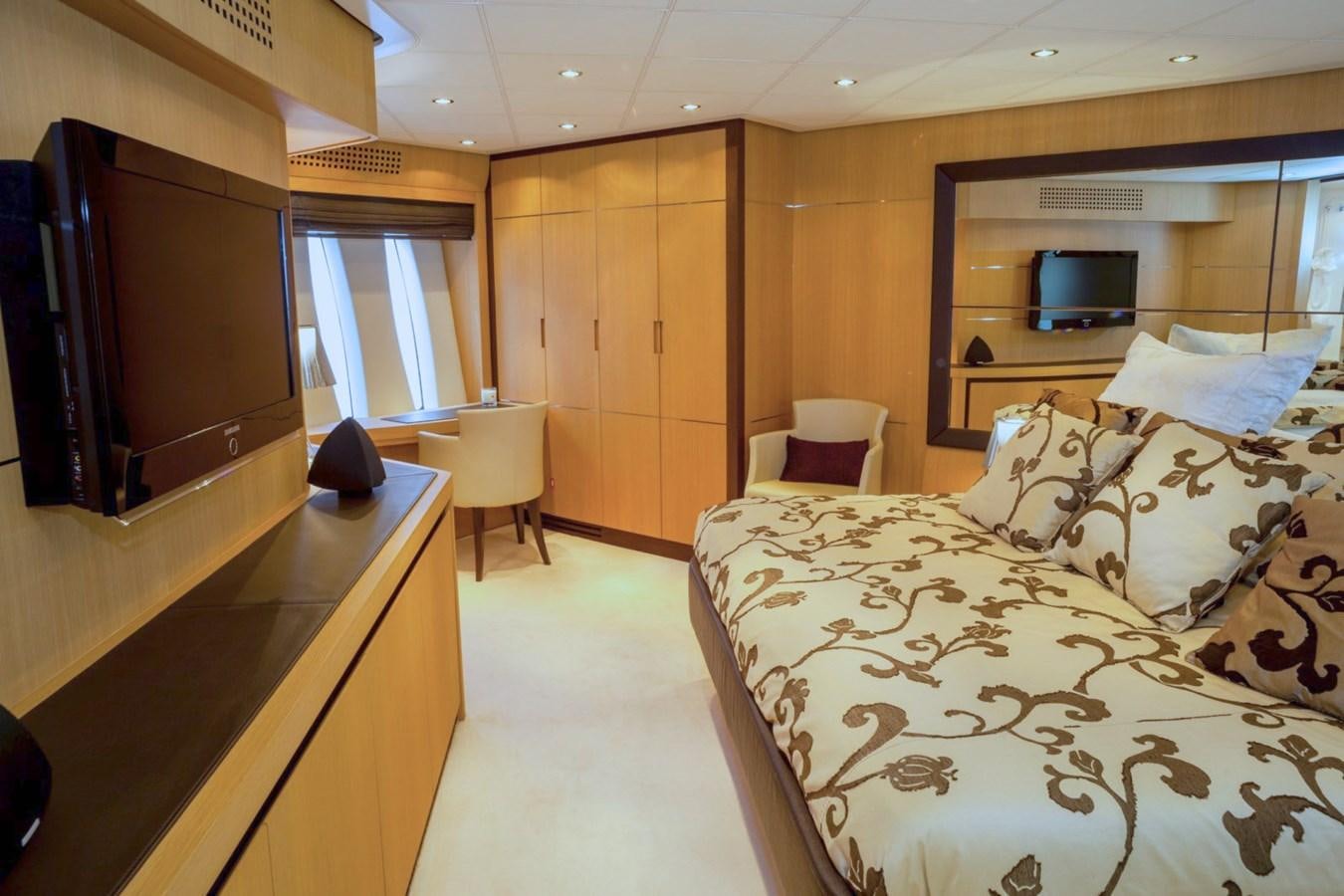 a room with a bed and a tv aboard A&O Yacht for Sale