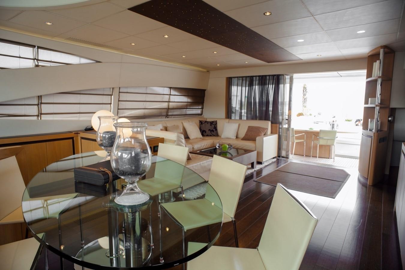 a room with a table and chairs aboard A&O Yacht for Sale