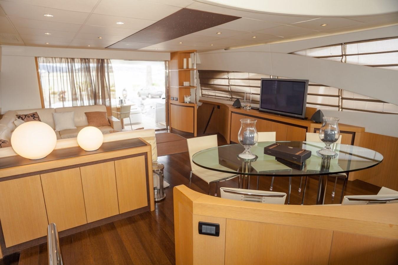 a room with a table and chairs aboard A&O Yacht for Sale