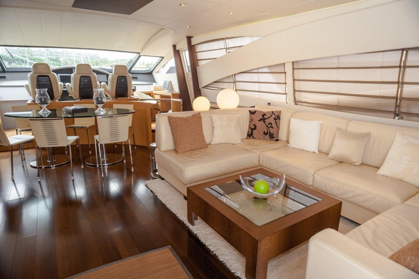 a living room with a couch and a table aboard A&O Yacht for Sale
