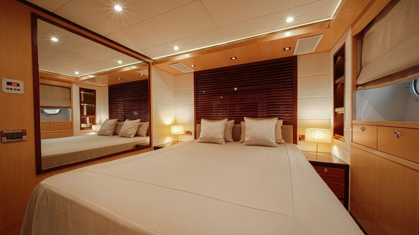 a hotel room with a large mirror aboard LARGO Yacht for Sale