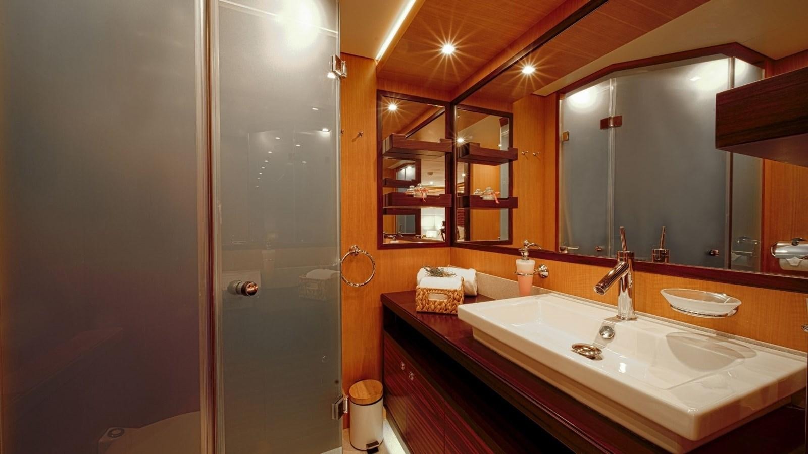a bathroom with a large mirror aboard LARGO Yacht for Sale