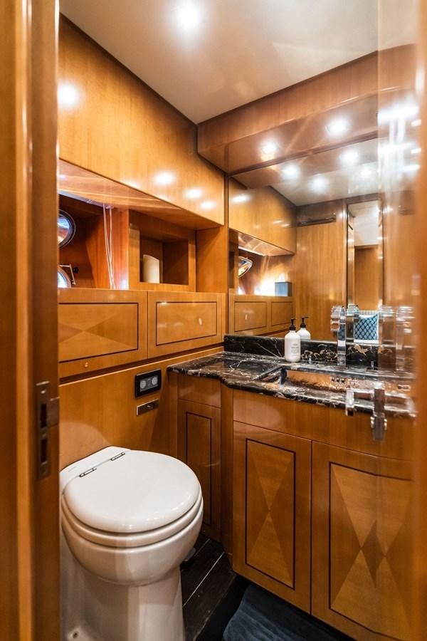 a bathroom with a toilet and a sink aboard PALOMA Yacht for Sale