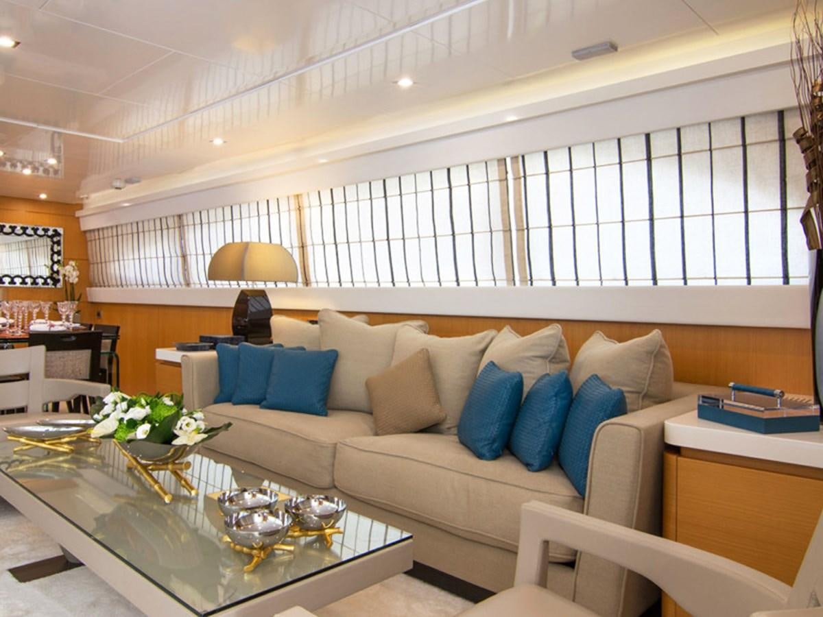a living room with a couch and a table aboard HABANO Yacht for Sale