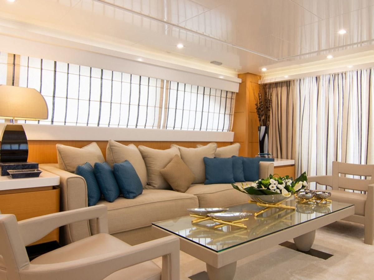 a living room with a couch and a table aboard HABANO Yacht for Sale