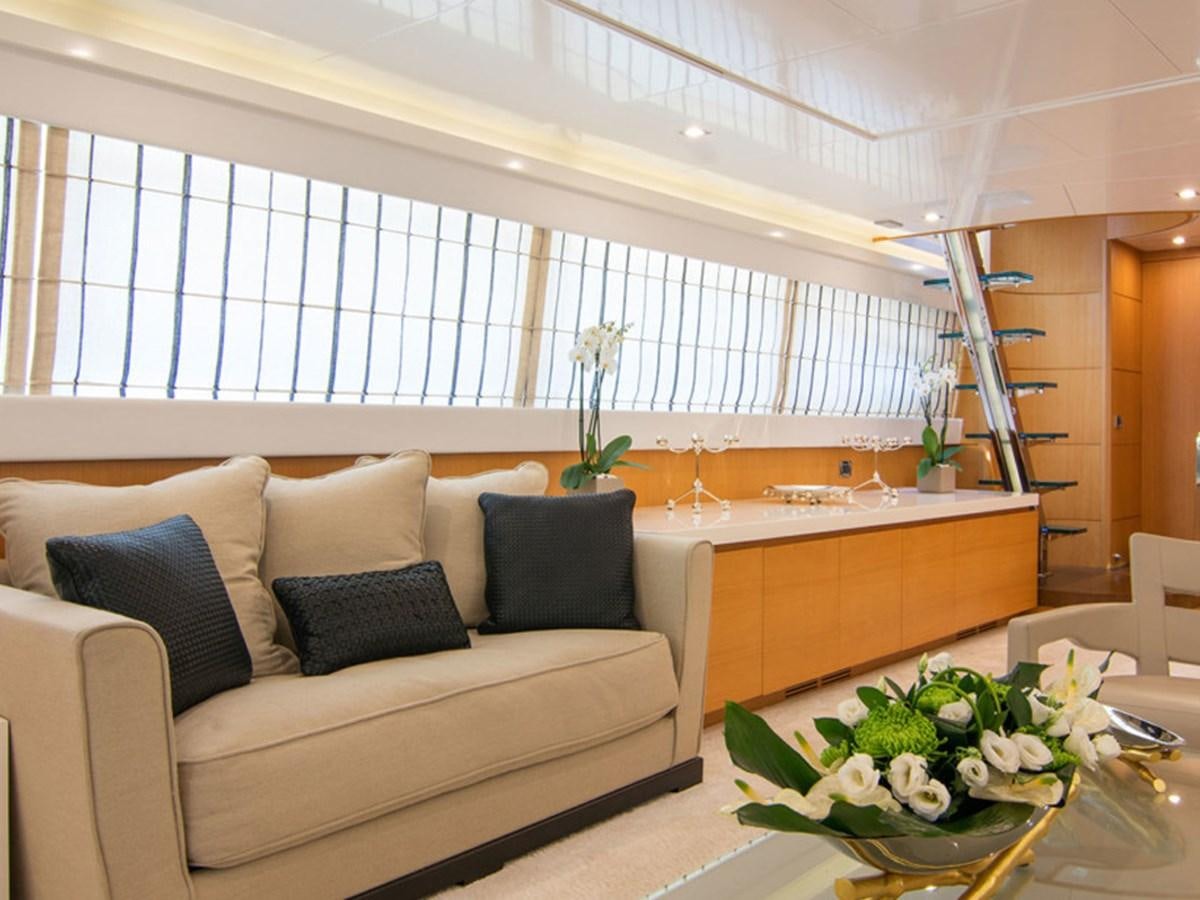 a living room with a couch and a table aboard HABANO Yacht for Sale