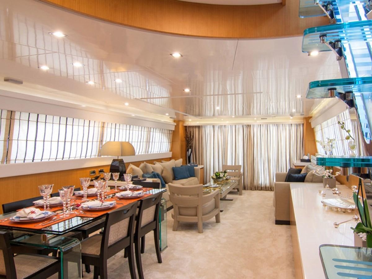 a large room with tables and chairs aboard HABANO Yacht for Sale