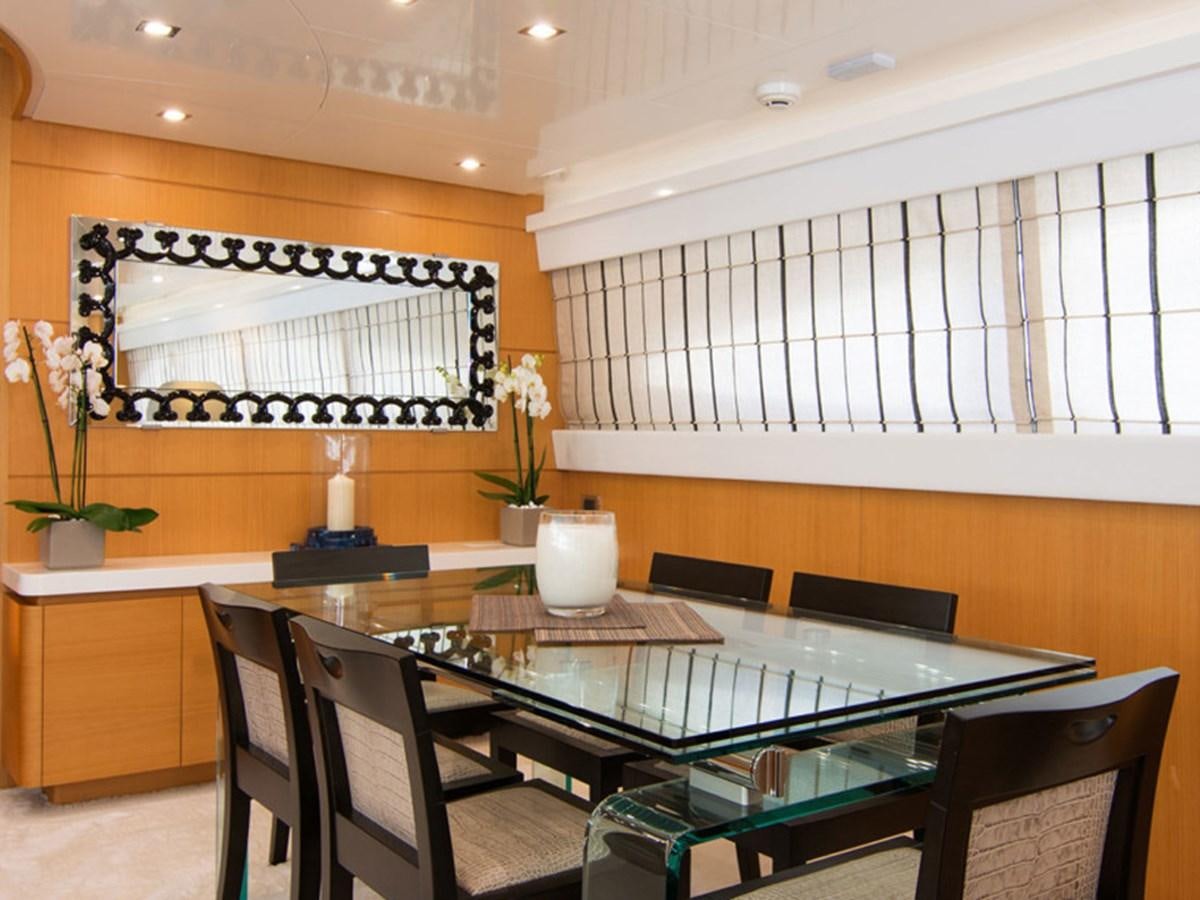 a room with a table and chairs aboard HABANO Yacht for Sale