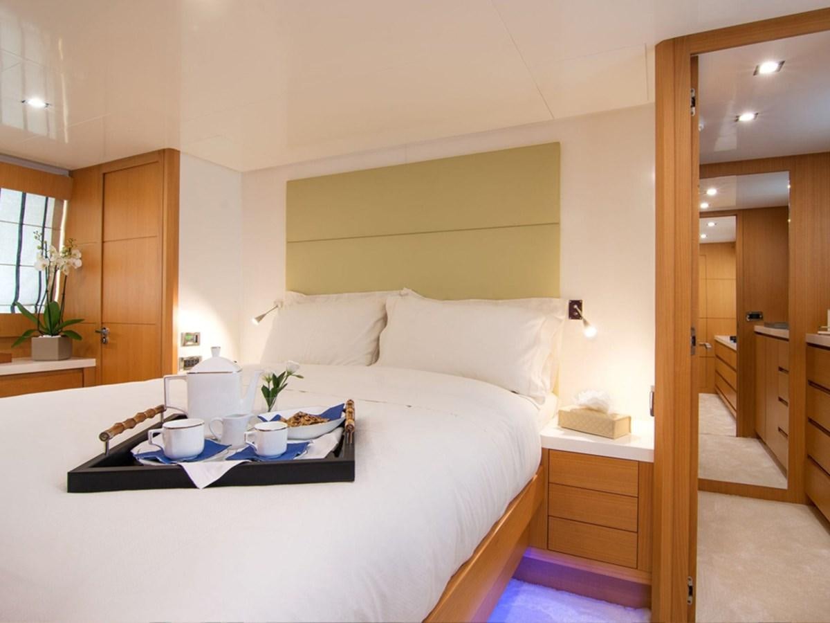 a bed with a white sheet aboard HABANO Yacht for Sale